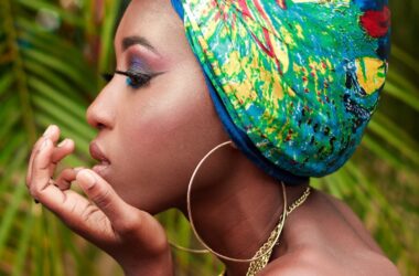 a woman with a colorful head scarf on her head